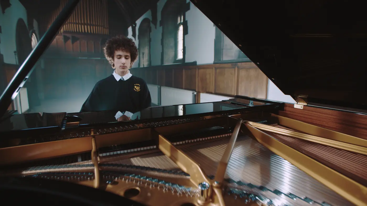 Boy playing Steinway piano at St Mary's Musci School Edinburgh